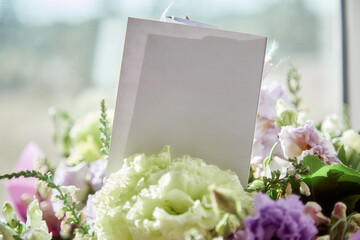 Mock up of post card close up with delicate big flowers bouquet of eustoma under day light. Copy...