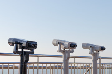 Tourist binoculars. Binoculars telescope on observation deck for tourist. 
Observatory telescope....