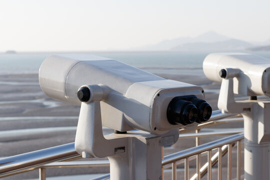 Tourist binoculars. Binoculars telescope on observation deck for tourist. 
Observatory telescope. Observation Binoculars.