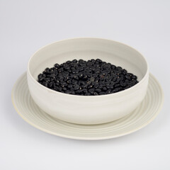 Black Beans on a plate on white background