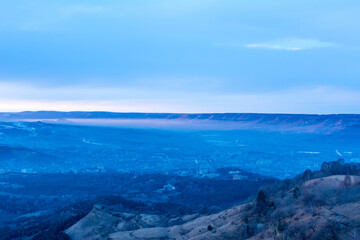 Kislovodsk, Russia. December 28, 2018. Evening view from a high mountain to the mountains and forest of Kislovodsk.