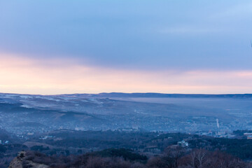 Kislovodsk, Russia. December 28, 2018. Evening view from a high mountain to the mountains and forest of Kislovodsk.