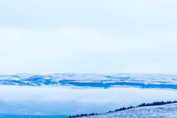 Kislovodsk, Russia. December 28, 2018. Majestic mountain peaks in the fog.