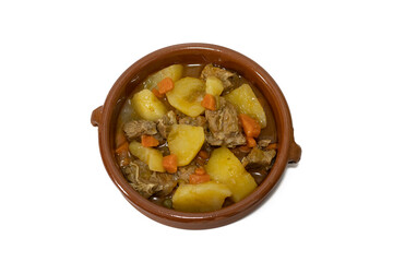 Potato stew with beef, a food widely consumed in Spain. Isolated on white. Selective focus, copy space