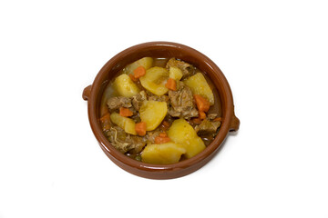 Potato stew with beef, a food widely consumed in Spain. Isolated on white. Selective focus, copy space