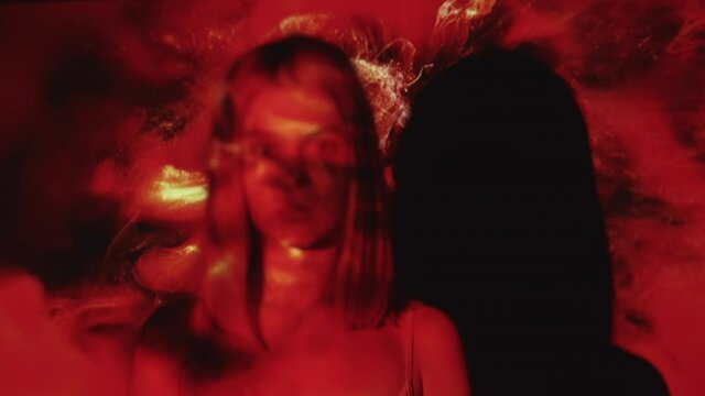 Desperate woman. Gynecology problem. Pregnancy abortion. Miscarriage depression. Child loss. Stressed sad girl on red color blood flow double exposure out of focus copy space.