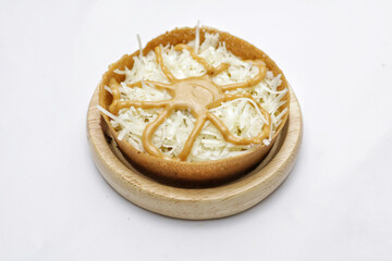 Martabak Mini or Martabak Mini Bangka with various Topping. The martabak mini bangka is made from a mixture of flour, eggs, sugar, baking soda, coconut milk and water.