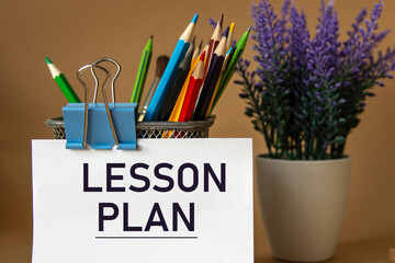 LESSON PLAN - words on a white sheet against the background of pencils and a bouquet of lavender