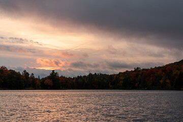 sunset over a lake in the fall