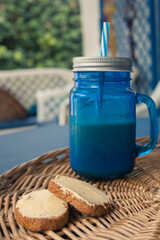 Simple and easy healthy breakfast with a red fruit smoothie with oat milk and toast