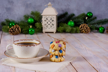 cup of coffee with cookies on a wooden table, christmas mood