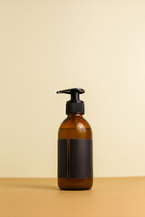 Beauty natural skincare products development concept. Dermatologist cosmetic skincare bottle with pump dispenser and organic ingredient on neutral background.