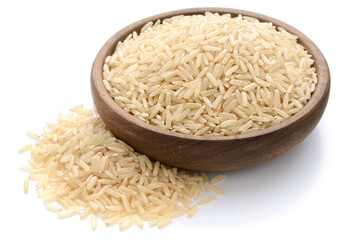 uncooked brown rice in the wooden bowl, isolated on the white background