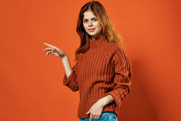 cheerful woman in red sweater posing fashion decoration