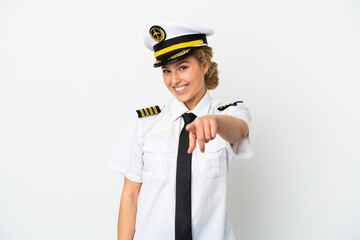 Airplane blonde woman pilot isolated on white background pointing front with happy expression