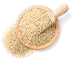 raw long brown rice in the wooden spoon, isolated on the white background, top view