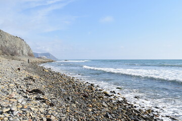 View of the Black Sea, beach and mountains. The resort town of Anapa. Russia. Photo taken in spring.