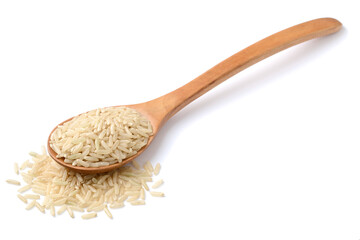 raw long brown rice in the wooden spoon, isolated on the white background