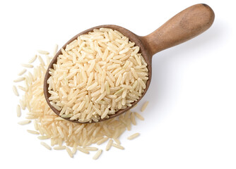 uncooked long brown rice in the wooden spoon , isolated on the white background, top view