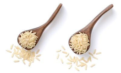 uncooked long brown rice in the wooden spoon , isolated on the white background, top view