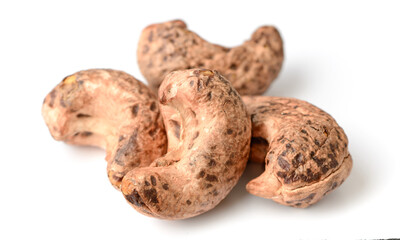 roasted cashew nuts with peel isolated on the white background