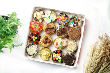 Martabak Mini or Martabak Mini Bangka with various Topping. The martabak mini bangka is made from a mixture of flour, eggs, sugar, baking soda, coconut milk and water.