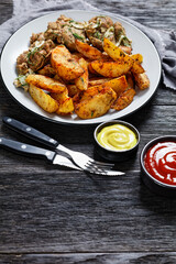 Grilled Pork Shoulder Steaks with potato wedges