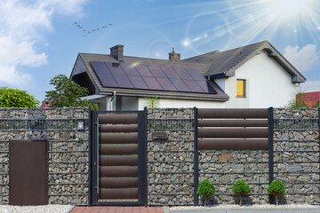 Solar panel installed on the modern house roof. © MAXSHOT_PL