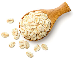 uncooked oatmeal in the wooden spoon, isolated on white, top view