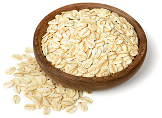 uncooked oatmeal in the wooden plate, isolated on the white background