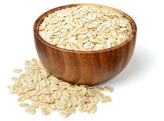 uncooked oatmeal in the wooden bowl, isolated on the white background