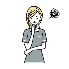 立って手をあごにあてて困っているエステ店員の女性