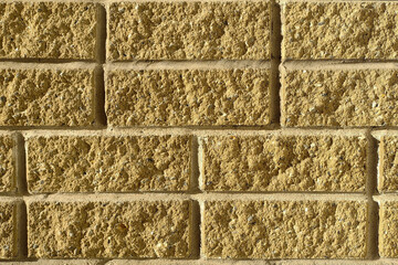 A fragment of the yellow brick wall of the building