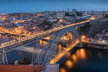 Fototapeta premium Porto, Portugal. Panoramic cityscape image of Porto, Portugal with the famous Luis I Bridge and the Douro River during amazing sunset.