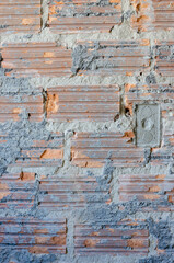 vertical closeup on a brickwork wall under construction, renovation