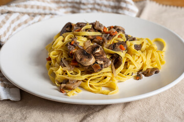 Italian homemade tagliatelle with mushrooms