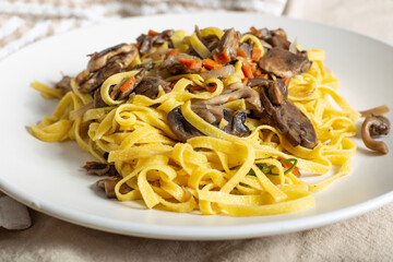 Italian homemade tagliatelle with mushrooms