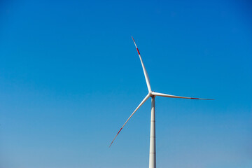 Wind electricity generator in summer fields, power plant, wind efficiency	
