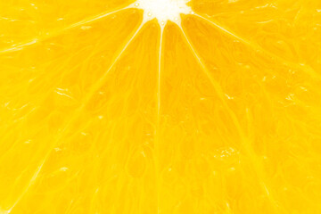 Extreme macro Close-up of Organic Indian Citrus fruit sweet limetta or mosambi (Citrus limetta) sliced part it show juice glands and seed, light passes through the slice,  it is an green and yellow