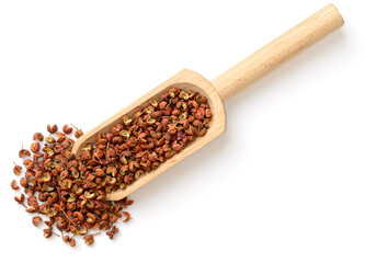 dried Sichuan peppercorns in the wooden scoop, isolated on the white background, top view - obrazy, fototapety, plakaty