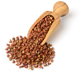 dried Szechuan peppercorns in the wooden scoop, isolated on the white background - obrazy, fototapety, plakaty