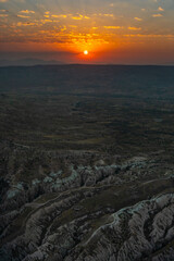 Cappadocia, Turkey - September 1, 2021 – Sunrise over Cappadocia, surrounded by volcanic fiery...