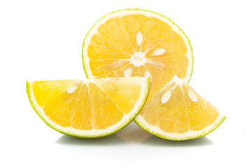 Close-up of Organic Indian Citrus fruit sweet limetta or mosambi (Citrus limetta) with its half cut, it is an green and yellow in color,  isolated over white background,