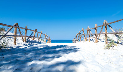 Beautiful white sand on the Baltic Sea. Entrance to the beach.