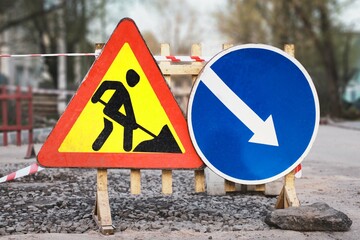 Warning sign of repair work, prescriptive sign indicating the side of the obstacle