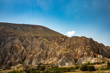 Cappadocia, Turkey - September 1, 2021 – Impressive nature by chimney rock formations and rock pillars of “love Valley” near Goreme, Cappadocia, Nevsehir, Turkey