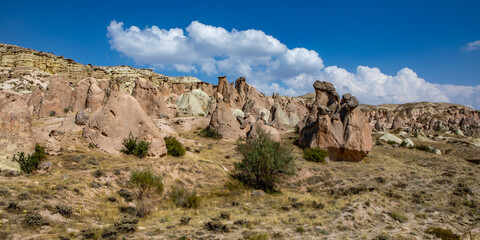 Cappadocia, Turkey - September 1, 2021 – Impressive nature by chimney rock formations and rock pillars of “love Valley” near Goreme, Cappadocia, Nevsehir, Turkey