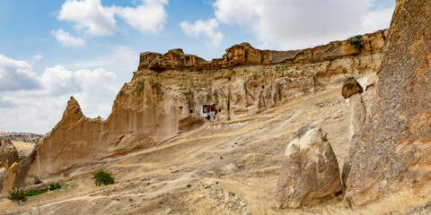 Cappadocia, Turkey - September 1, 2021 – Impressive ancient cave home which had been carved in the Vulcanic rock cliff face of Pigeon Valley at Uchisar in the Cappadocia region of Turkey.