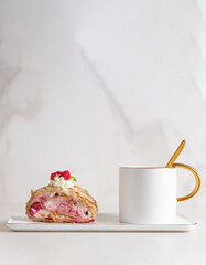 Meringue roll cake with berries whipped cream and coffe on marble background. Copy space.