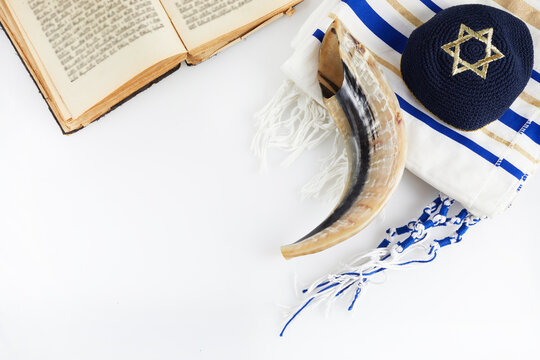 Yom kippur, Rosh hashanah, jewish New Year holiday, concept. Religion image of shofar - horn on white prayer talit.